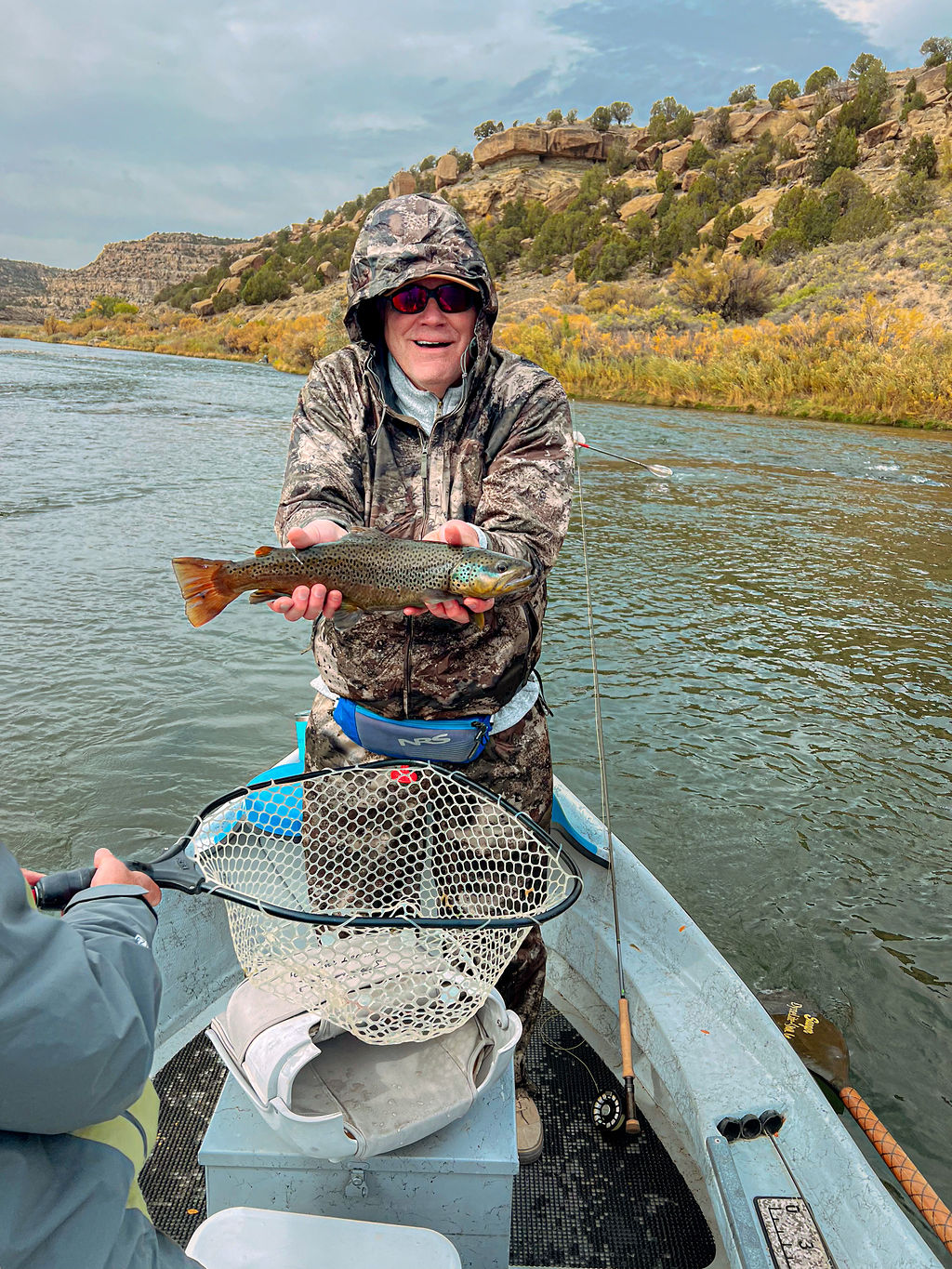 One of San Juan River guides showing a rainbow trout.